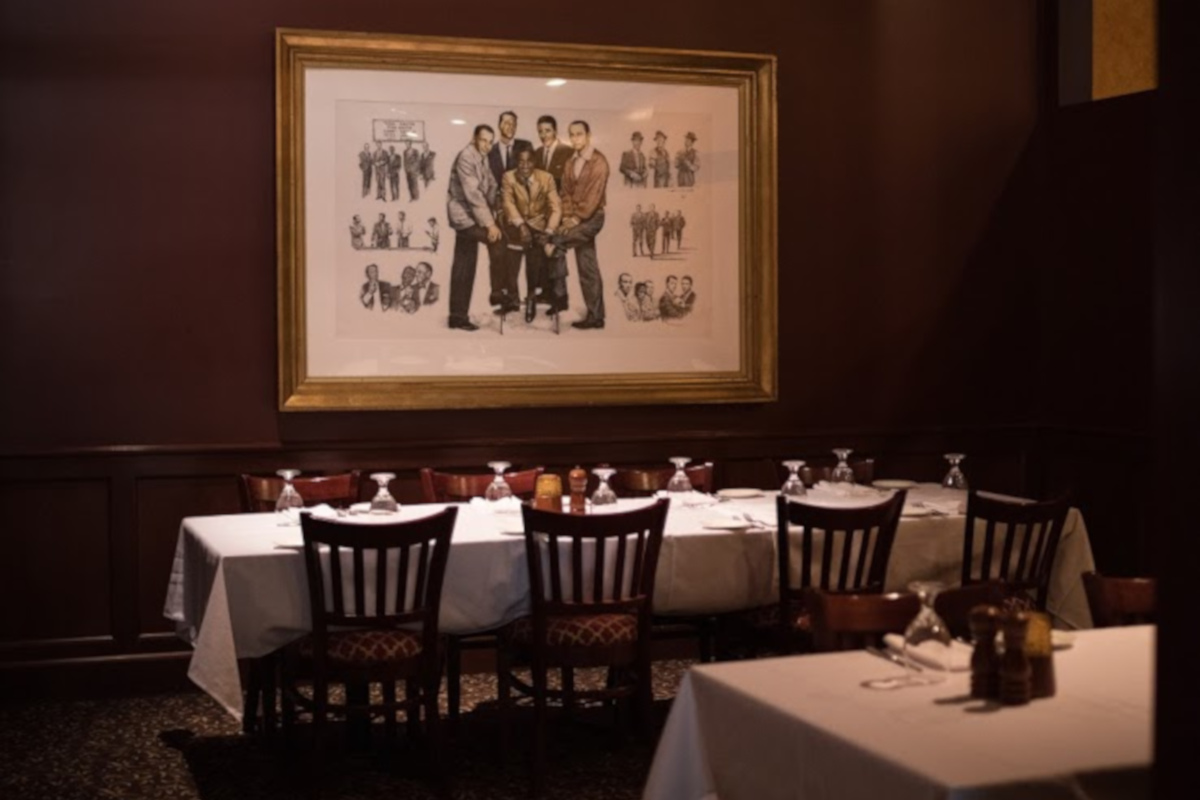 tables set for private party, wall painting